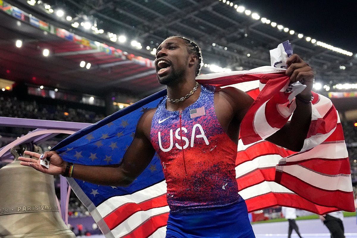 Noah Lyles, of the United States, celebrates after winning the men's 100-meters final at the 2024 Summer Olympics, Sunday, Aug. 4, 2024, in Saint-Denis, France. -  (AP Photo/Matthias Schrader)